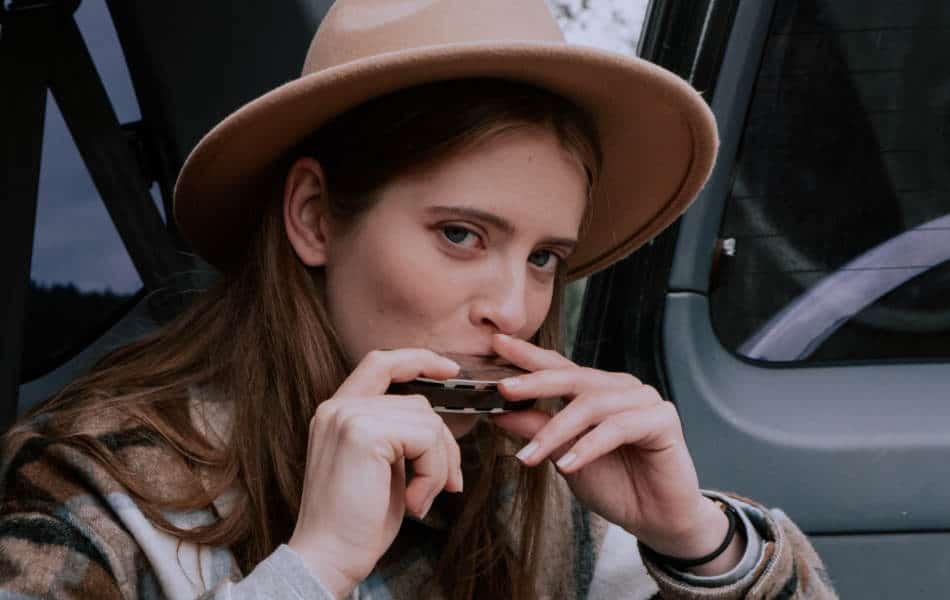 Woman playing the harmonica